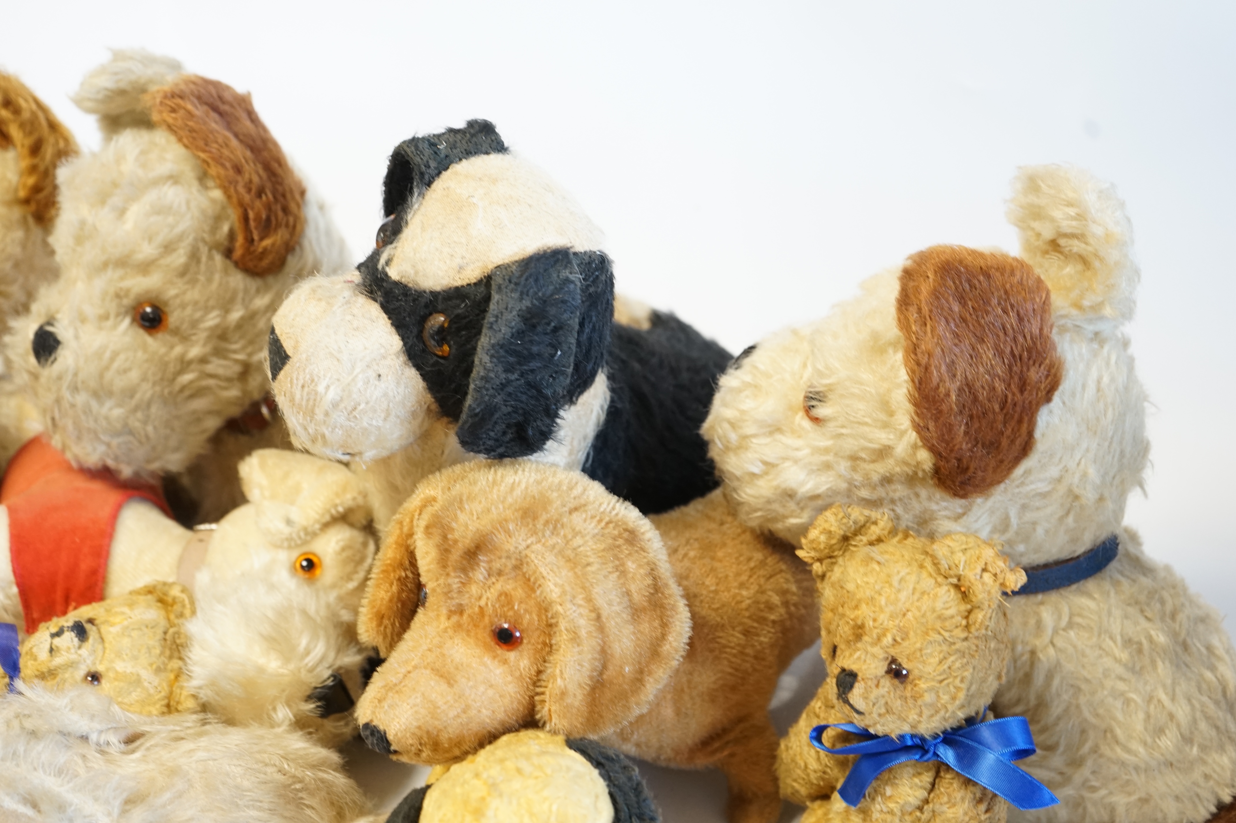 Four Merrythought dogs and three others, c.1950's, together with three cotton plush bears and one rabbit (11). Condition - fair